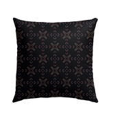 Close-up of the Blossom Breeze Outdoor Pillow's weather-resistant fabric in a garden setting.